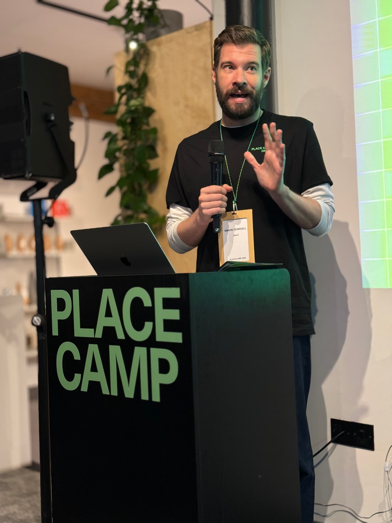 Simon Yewdall speaking at the Place Camp 2025 lectern